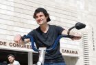 A man in a dark shirt poses on an electric bike after completing a virtual autism evaluation with NeuroSpark Health.