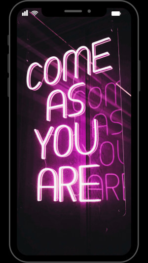 Cell phone with the words ‘come as you are' in neon pink, reflecting NeuroSpark Health’s affirming assessment approach.