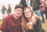 A happy couple smiles for the camera while celebrating an adult autism diagnosis.