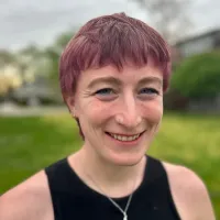 Headshot of Cat Salladin, LSW of NeuroSpark Health, specializing in neurodivergent coaching for autistic and ADHD adults.