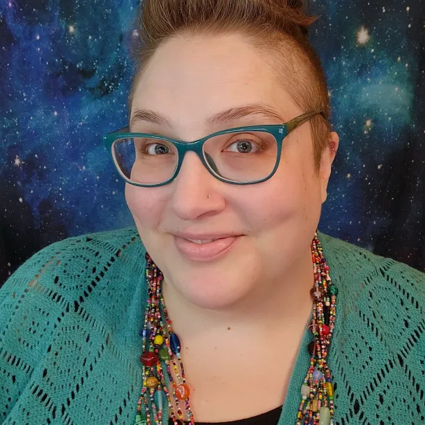 Headshot of Jennifer Alumbaugh, MS of NeuroSpark Health, specializing in neurodivergent coaching and ADA accommodations for autistic and ADHD adults.