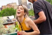 A couple from the NeuroSpark Health community enjoy a rooftop restaurant.