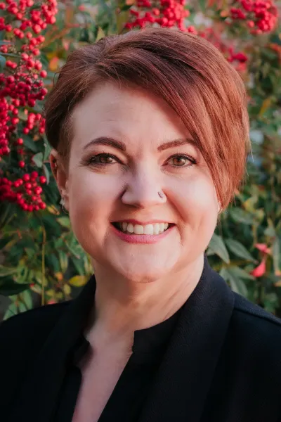 Headshot of Laurel Alexander, LCSW of NeuroSpark Health, specializing in neurodivergent coaching for autistic and ADHD adults.