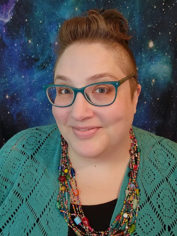 Headshot of Jennifer Alumbaugh, MS of NeuroSpark Health, specializing in neurodivergent coaching and ADA accommodations for autistic and ADHD adults.