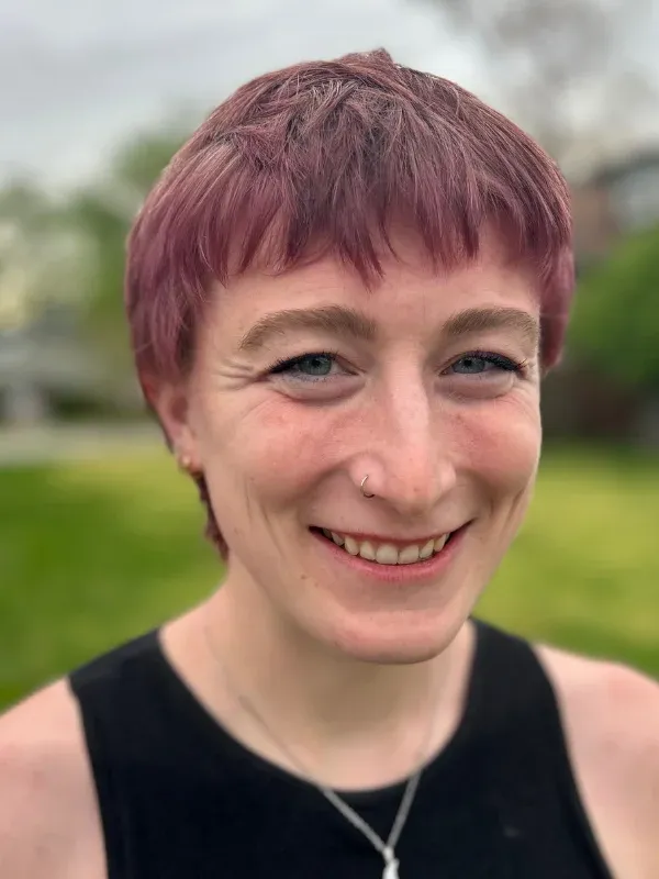 Headshot of Cat Salladin, LSW of NeuroSpark Health, specializing in neurodivergent coaching for autistic and ADHD adults.