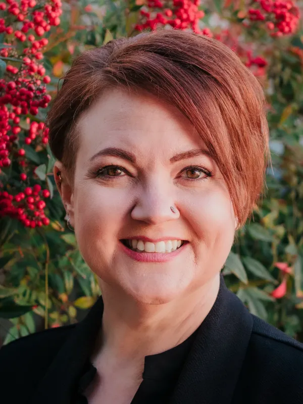 Headshot of Laurel Alexander, LCSW of NeuroSpark Health, specializing in neurodivergent coaching for autistic and ADHD adults.