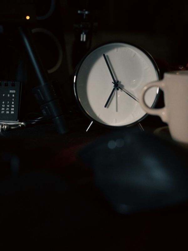 An alarm clock represents possible ADA accommodations accessed through the accommodations support services for autistic adults at NeuroSpark Health.